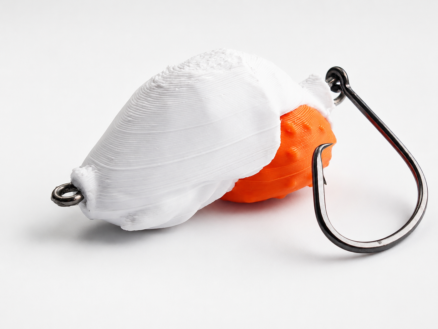 SandSpawn New Dawn artificial sand flea lure in white and orange with hook on a white background.