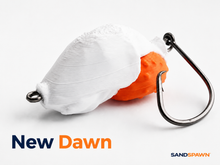 SandSpawn New Dawn artificial sand flea lure in white and orange with hook on a white background.
