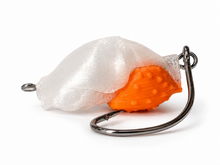 Side profile of the SandSpawn Pompano Sushi artificial sand flea lure in pearl and orange with hook.
