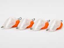 Four SandSpawn Pompano Sushi artificial sand flea lures in pearl and orange without hooks on a white background.